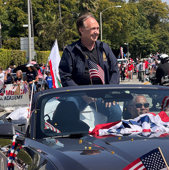 Asm. Zbur seated in back of parade car