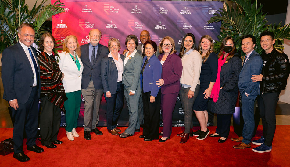 Group photo of LGBTQ+ and allied lawmakers with Equality Awards backdrop