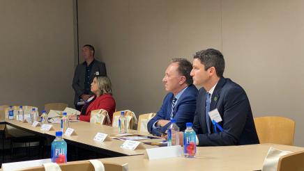 Asm. Zbur and Asm. Gabriel seated, listening to a discussion with leaders from the Jewish Federation