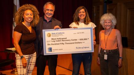 Asm. Zbur presenting large ceremonial check to Rehabilitation of West Hollywood staff