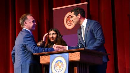 Assembly Speaker-elect Robert Rivas shaking hands with Asm. Zbur as his daughter proudly watches