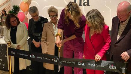 Tia Co-founder and President Felicity Yost cutting the ribbon marking the Grand Opening of the Tia clinic
