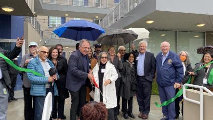 Asm. Zbur and Mayor Davis smiling after successfully cutting the ribbon, marking the official opening of the Las Flores Apartments