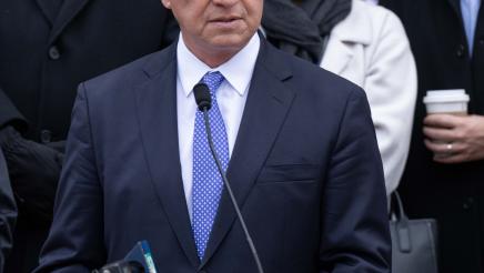 Asm. Zbur at podium, speaking