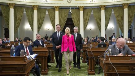 Asm. Zbur escorting guests up aisle on the Assembly Floor