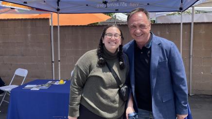 Asm. Zbur with constituent at street fair booth