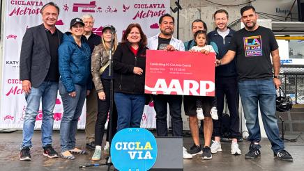 Group photo of Asm. Zbur onstage with guest speakers and event organizers