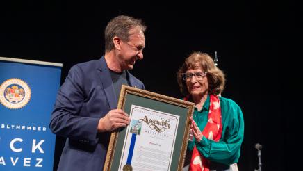 Marian Dodge accepts the AD51 Community Excellence Award for Environmental Protection.