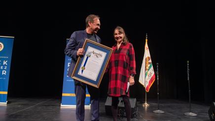 Cindy Chvatal-Keane receives the AD51 Community Excellence Award for Neighborhood Advocacy.