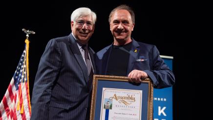 Hon. Dr. Julian Gold receives the AD51 Community Excellence Award for Distinguished Service in Local Government.