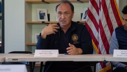 Asm. Zbur speaking and gesturing with one hand