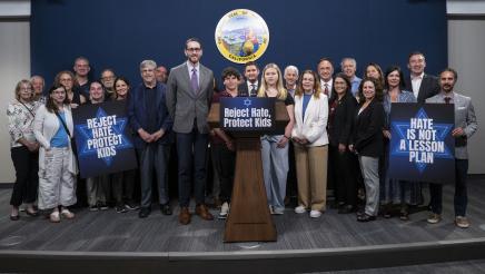 Group photo of Asm. Zbur, students, legislators and activists